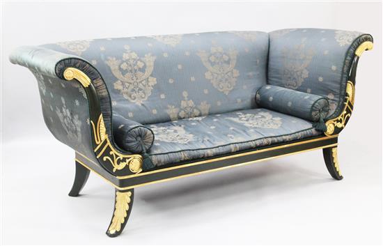 An Empire style parcel gilt ebonised boat-shaped settee, W.6ft 10in. D.3ft 3in. H.3ft